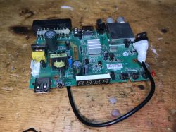 Circuit Board with 7-Segment Display A circuit board with electronic components and a 7-segment display.