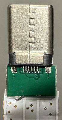 LED connector resembling USB-C on a green PCB.