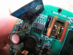 Inside the Tuya BSD29 Smart Plug Close-up of the interior of a Tuya BSD29 smart plug, showing electronic components.