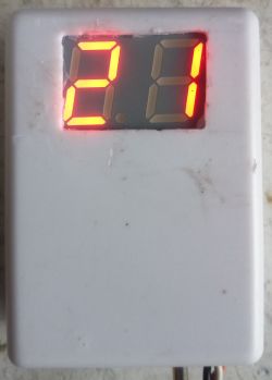 DIY thermometer with LED display showing 28°C in a white plastic casing.