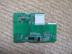 Cozylife DS-1211AN PCB PCB with electronic components and a connector on a carpet.