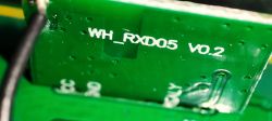 Close-up of a green circuit board with the label WH_RXD05 V0.2