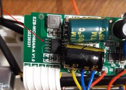 Image of a circuit board labeled EZB-WCH60AN-A V1.0, showing electronic components and two capacitors.