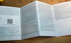 Sonoff energy meter user manual unfolded on a table.