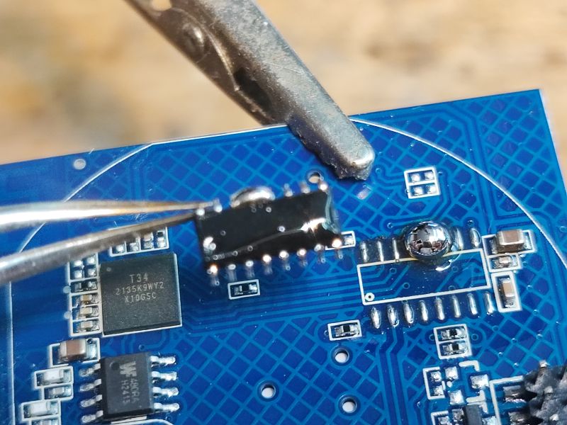 T34 Integrated Circuit on Electronic Circuit Board Close-up of an electronic circuit board with integrated circuits, including one labeled T34.
