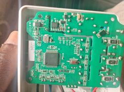Printed circuit board (PCB) with electronic components inside a casing.
