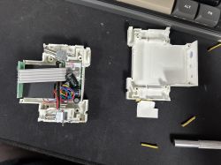Disassembled Tuya WiFi Smart Circuit Breaker Disassembled Tuya WiFi Smart Circuit Breaker 63A on a table.