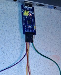 CP2102 module connected to a board via wires.
