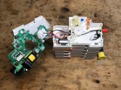 Disassembled Tuya Energy Meter Disassembled 3-phase Tuya energy meter with visible electronic components.