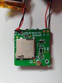 Printed circuit board with memory card slot A printed circuit board with electronic components, a memory card slot, and connected wires.