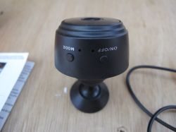 Small Security Camera on a Stand Black security camera on a stand, top view.