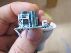 Electronic Circuit Board in Hand Electronic circuit board with components held in a hand.