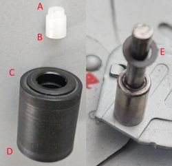 Zbliżenie na części mechaniczne z magnetowidu, oznaczone literami A–E, w tym gumowa rolka, biały plastikowy element i metalowy trzpień z podkładką.