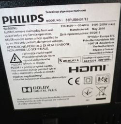 Etykieta informacyjna z tyłu telewizora Philips model 55PUS6401/12 z ostrzeżeniami i danymi technicznymi.