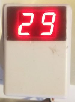 Two-digit red LED display showing value 29 on a white casing