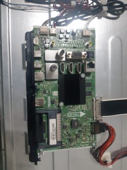 View of a motherboard with various ports and cables connected to it.