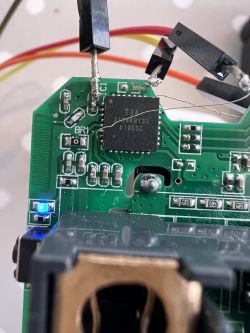 Close-up of a circuit board with an integrated circuit and a missing capacitor marked as C1.