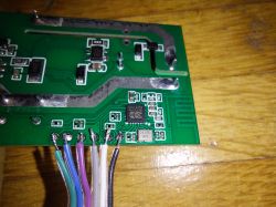 WiFi relay PCB with soldered wires on connection points.