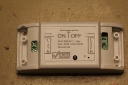 Wi-Fi smart switch with a label describing technical specifications.