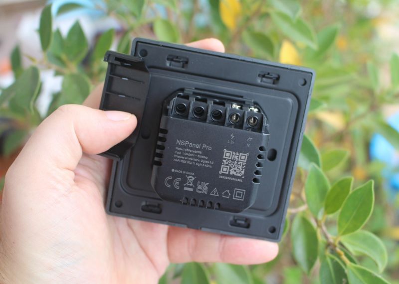 Back of Sonoff NSPanel Pro with visible connectors and markings.
