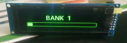 Display showing the text BANK 1 with a progress bar on a green background.
