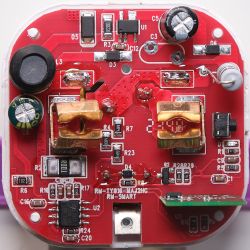Red RMC004 circuit board with electronic components.