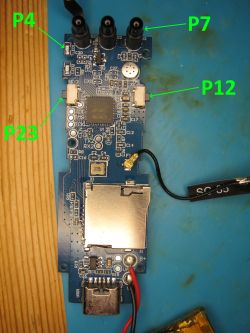 PCB with labeled components and connectors on a blue work mat