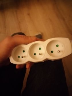 Unlocking Green Caps Blocking Sockets in Extension Cord - User Guide
