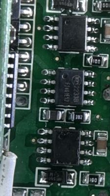 Close-up of a printed circuit board with various electronic components in SOIC packages.