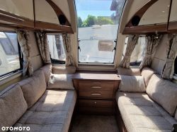 Interior of a modern camper with comfortable sofas.