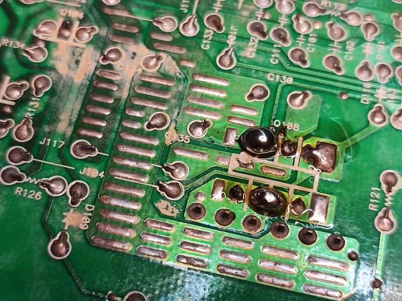 Circuit Board with Electronic Components and Solder Marks Close-up of a circuit board with electronic components and solder residue