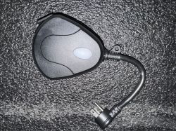 Black Feit PLUG3/WIFI/WP/2 Plug View of a black Feit PLUG3/WIFI/WP/2 plug on a dark surface.