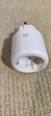 Elivco Smart Plug with Power Button White smart plug with a power button on a smooth background.