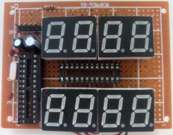 Universal PCB with four 7-segment LED displays and DIP sockets.