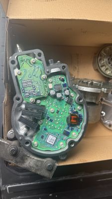 PCB in a housing with SMD parts marked “223” and a coil at the lower right