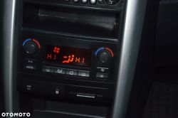 Car climate control panel with “HI” on the display and airflow/defrost icons