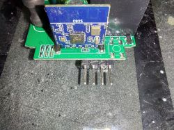 Close-up of an electronic board with a CB2S module and protruding pins.