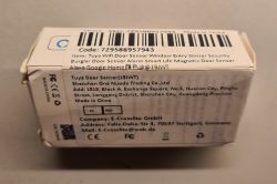 Packaging of Tuya Wifi Door Sensor with SKU code and manufacturer information.