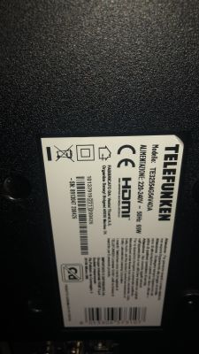 Label on the back of a TELEFUNKEN TV showing model, power data and certifications