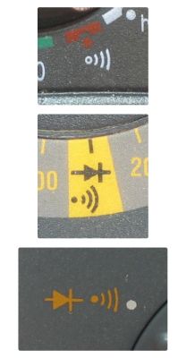Close-ups of symbols and markings on an electrical meter.