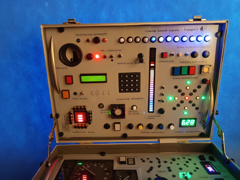Top Panel of the Voyager 3 Expedition Control Center Control panel of a space-themed toy console with many buttons, LEDs, and electronic displays.