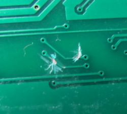 Damaged Traces on a Circuit Board Damaged traces on a printed circuit board.