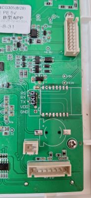 Printed Circuit Board with Labels and Connectors Photo of a printed circuit board with labels: RST, RX, TX, VDD, GND, and connectors.
