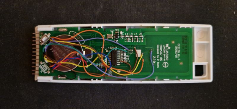 Modifying RF Remote with WiFi Integration Interior of an open remote with wires connected to the circuit board