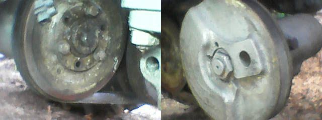 Zdjęcie dwóch metalowych elementów maszyny, prawdopodobnie układu hamulcowego lub mechanicznego traktora.