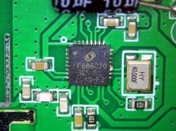 Close-up of a PCB with F68C20 chip and electronic components.