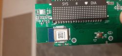 Circuit board with electronic components, including a BLE module and LED display.