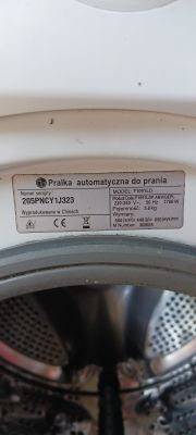 Tabliczka znamionowa pralki LG F1091LD z widocznym numerem seryjnym