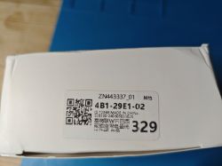 Box Sticker with Barcode Sticker with barcode and Chinese characters on a box.
