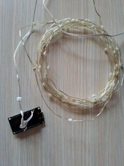 ESP32 module connected to a LED strip.